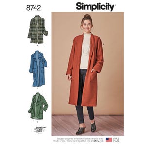 May include: Simplicity pattern 8742 features coat designs. The image shows a woman wearing a long, rust-colored coat with pockets. The pattern includes illustrations of coats in green, blue, and a black and white houndstooth pattern. The Simplicity logo and "Since 1927" are visible.