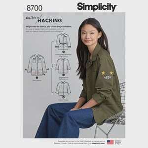 May include: Simplicity 8700 pattern hacking sewing instruction sheet featuring a khaki green utility jacket with two yellow star patches on the sleeve. The document displays a base pattern and three design variations including drawstring pockets, ruffle sleeves, and a peplum.