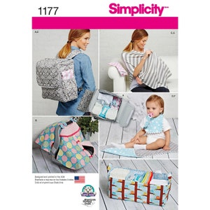 May include: A sewing pattern for baby items, including a diaper bag, a nursing cover, a bib, a car seat cover, and a diaper caddy. The pattern is from Simplicity and the number is 1177.