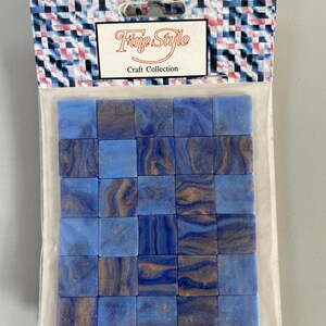 May include: A package of blue and brown mosaic tiles. The package is labeled "Fine Style Craft Collection".