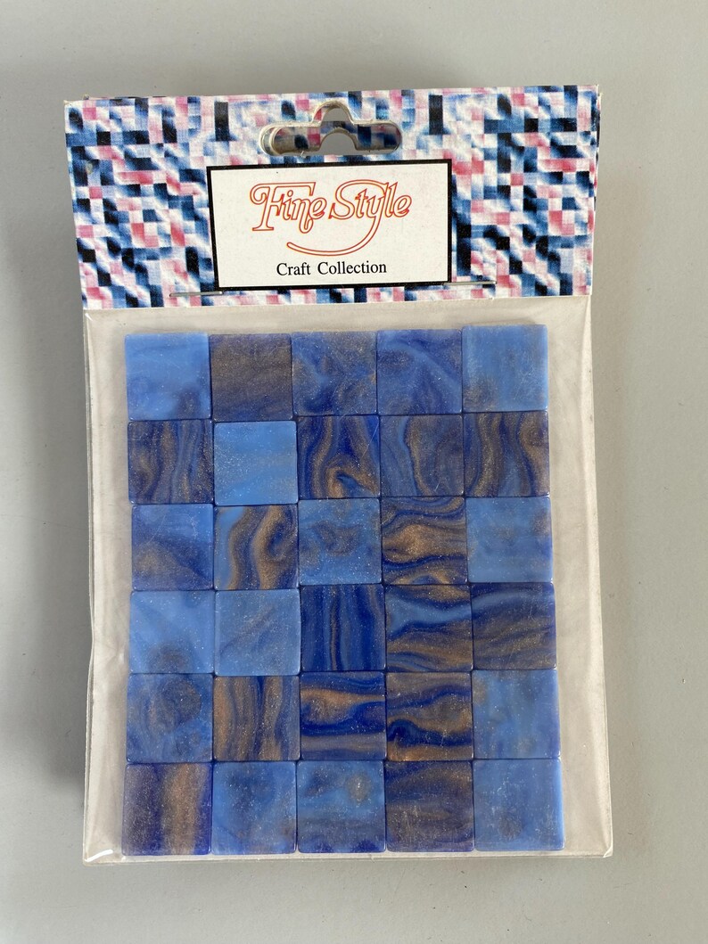 May include: A package of blue and brown mosaic tiles. The package is labeled "Fine Style Craft Collection".