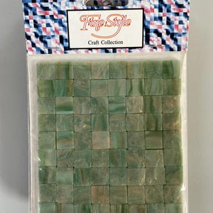 May include: A package of green and gold mosaic tiles. The package is labeled "Fine Style Craft Collection".