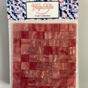 May include: A package of red iridescent mosaic tiles. The package is labeled "Fine Style Craft Collection".