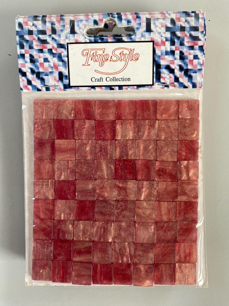 May include: A package of red iridescent mosaic tiles. The package is labeled "Fine Style Craft Collection".