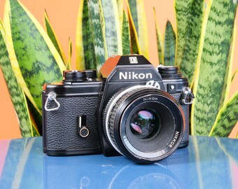 Objectif Nikon EM 35 mm SLR 50 mm f/2 | Lis la description