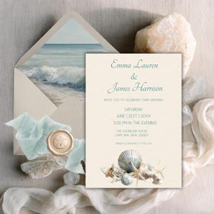 May include: A wedding invitation with a beach theme. The invitation card features the names "Emma Lauren & James Harrison" and event details. An envelope with a beach scene and a wax seal with a starfish design are also present.