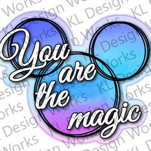 May include: A colorful graphic design with a Mickey Mouse silhouette. The design features three overlapping circles with a watercolor gradient in shades of blue, purple, and pink. The text "You are the magic" is written in white cursive font.