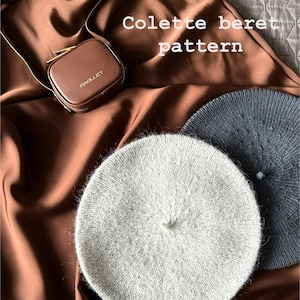 May include: Two knitted berets, one light gray and one dark gray, are displayed on a brown satin fabric. A small brown leather case with a gold clasp is also present. The text "Colette beret pattern" is overlaid on the image.
