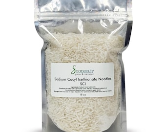 May include: A clear, resealable plastic pouch filled with white Sodium Cocyl Isethionate noodles. The label reads Soapbeauty pure & natural, Sodium Cocyl Isethionate Noodles SCI, Ingredients: Sodium Cocyl Isethionate, Directions for Use, Storage, and 16 oz.