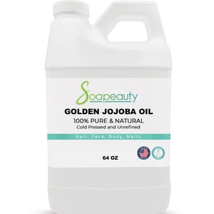 May include: A white plastic jug of Soapeauty Golden Jojoba Oil. The label includes the text "100% Pure & Natural" and "Cold Pressed and Unrefined". It is for hair, face, body, and nails. The jug contains 64 oz of oil.
