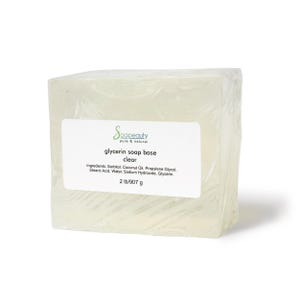 May include: A clear glycerin soap base wrapped in plastic. The label reads "Soapeauty pure & natural glycerin soap base clear" and lists the ingredients: Sorbitol, Coconut Oil, Propylene Glycol, Stearic Acid, Water, Sodium Hydroxide, Glycerin. The label also states "2 lb/907 g".
