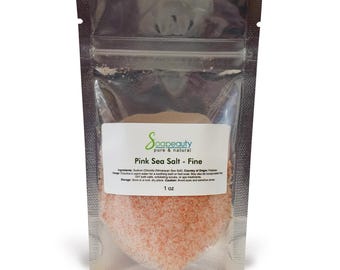 May include: A clear, resealable bag filled with pink sea salt. The label reads "Soapeauty pure & natural" and "Pink Sea Salt - Fine". The bag contains 1 oz of salt. The pink salt is a fine grain and fills the bottom of the bag.