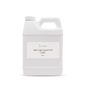 May include: A white plastic jug with a handle, labeled "extra virgin coconut oil" with the brand name "spacebeauty" and the text "cold pressed, unrefined, 32 OZ".