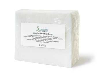 May include: A white shea butter soap base bar wrapped in plastic. The label reads "Soapeauty pure & natural shea butter soap base" and lists the ingredients.