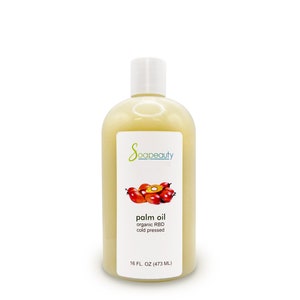 May include: A clear bottle of Soapeauty palm oil. The label features the brand name, a graphic of palm fruits, and text indicating it's organic, cold-pressed, and 16 fl oz (473 mL). The bottle has a white cap.