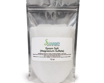 May include: A clear, resealable plastic pouch filled with white Epsom salt, labeled Soapbeauty pure & natural, Epsom Salt (Magnesium Sulfate), 12 oz. The label includes ingredients, usage, storage, and caution text printed in black ink.