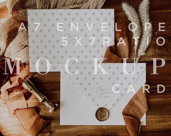 May include: A7 envelope mockup with a 5x7 card, both with a white background and a light gray polka dot pattern. The envelope and card are on a wooden surface with a brown ribbon and a gold wax seal.