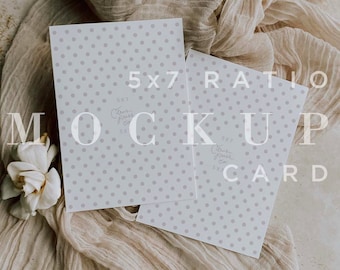 May include: Two white cards with a light gray polka dot pattern. The cards are laying on a beige fabric with the text "5x7 Ratio Mockup Card" printed on them.