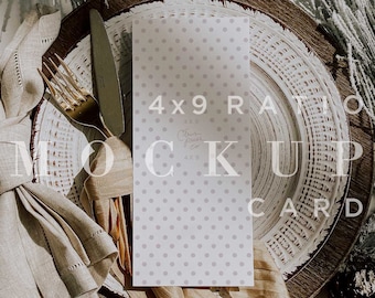 May include: A mock-up card with a polka dot pattern, placed on a rustic wooden charger plate, with gold cutlery and a linen napkin. The card reads "4x9 Ratio Mock Up Card". The scene is decorated with pine branches and a silk ribbon.
