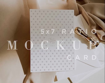 May include: A white card with a polka dot pattern and the text "5x7 Ratio Mock Up Card" printed on it. The card is lying on a beige fabric surface.