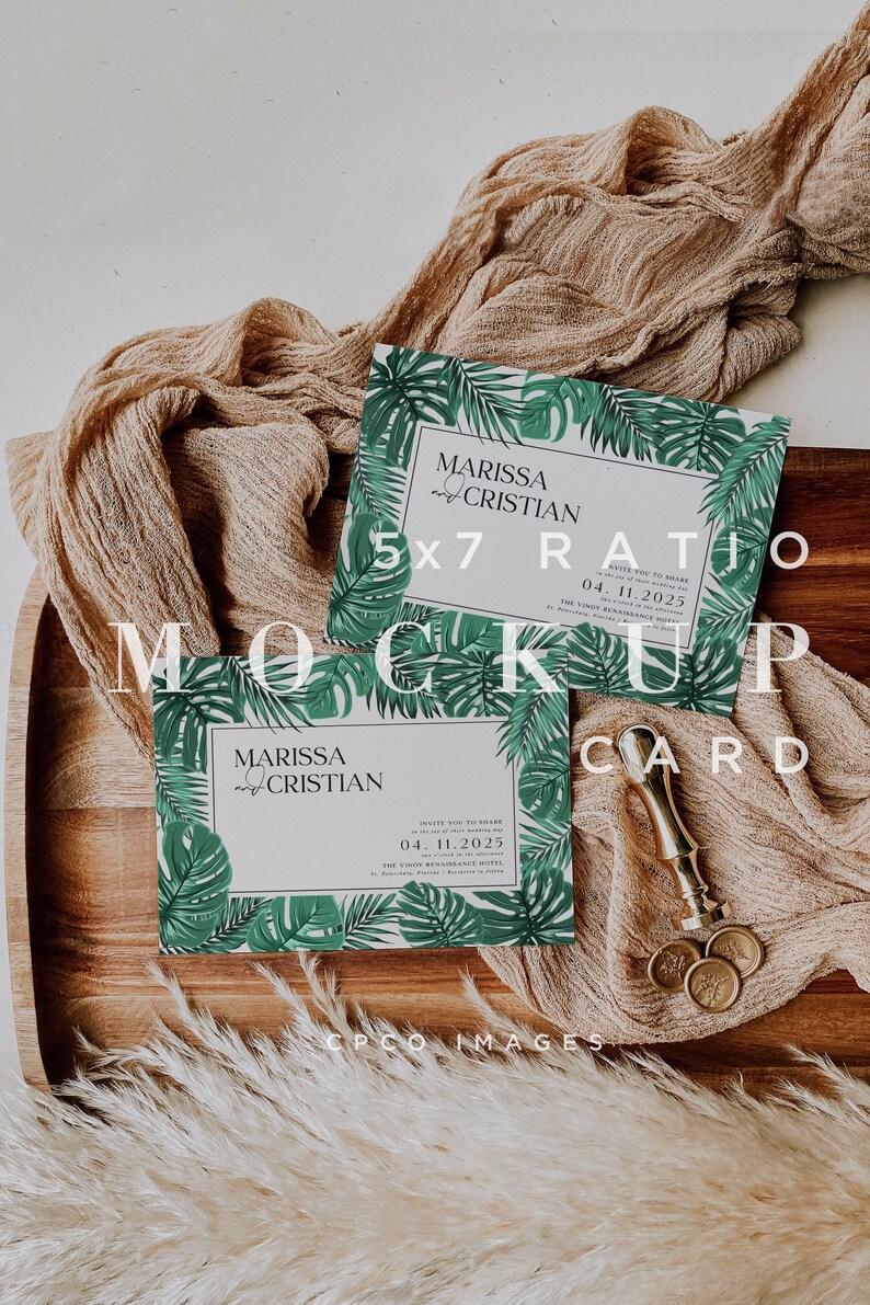 May include: Two 5x7 inch tropical-themed wedding invitations with a green and white color scheme. The invitations feature a leafy border with the text "MARISSA & CRISTIAN" and the date "04.11.2025".