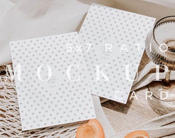 May include: Two 5x7 ratio mockup cards with a light gray polka dot pattern. The cards are on a wooden tray with apricots and a glass. The text "MOCKUP CARD" is overlaid on the image.