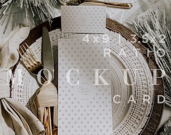 May include: A mockup card with a polka dot pattern, placed on a decorative plate with a gold spoon and knife. The card is surrounded by linen napkins and decorative pine branches. The card dimensions are 4x9 inches and 3.5x2 inches.