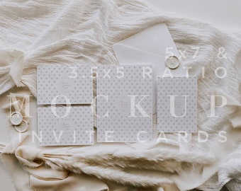 May include: Four white invitation cards with a light gray polka dot pattern and the text "Save the Date" on a white fabric background. The cards are 3.5 x 5 inches and there is a white envelope and a wax seal on the fabric.