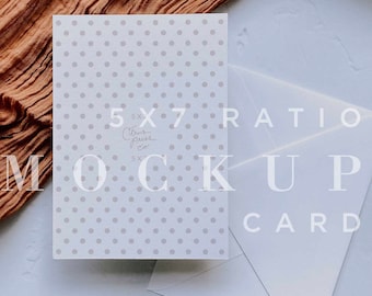 May include: A white card with a polka dot pattern and the text "5x7 Ratio Citrus Press Co. 5x7 Mockup Card" on it. The card is lying on a white surface with a brown fabric draped over the top left corner.