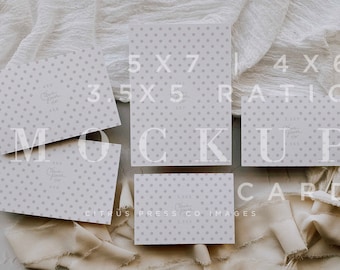 May include: A flat lay mockup of four different sized cards with a polka dot pattern. The cards are arranged on a white surface with a beige fabric draped over the cards. The text "5x7", "3.5x5", "4x6", and "Citrus Press Co Images" is visible on the cards.
