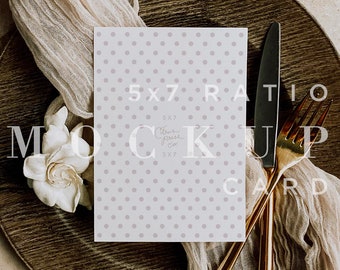 May include: A white card with a light gray polka dot pattern. The card is on a brown plate with a gold fork and knife. The text on the card reads "5x7 Ratio Mockup Card".