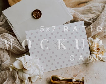 May include: A white envelope with a gold wax seal, a 5x7 ratio card with a light purple polka dot pattern, a gold wax stamp, and a white flower on a beige fabric background. The card has the text "5x7 Ratio Mockup Card" printed on it.