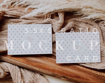 May include: Two white cards with a polka dot pattern and the text "3.5x5" and "3.5x5 Card" on a wooden surface with a beige fabric and a white fluffy grass plant.