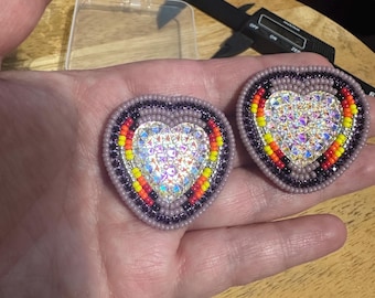 Handmade indigenous earthy purple and fire colored heart shaped earrings on push back posts