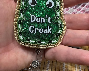 Beaded badge reel, frog shaped, “don’t croak” funny