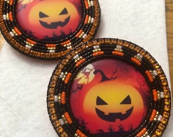 Jack-o-lantern and candy corn themed beaded earrings on leverback posts