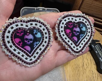 Handmade beaded  heart  with spooky skulls earrings on leverback posts