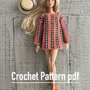 May include: A crochet pattern for a doll dress with a striped design in shades of brown, orange, purple, and white. The dress has a round neckline and long sleeves. The pattern is available as a PDF download. Crochet Pattern pdf