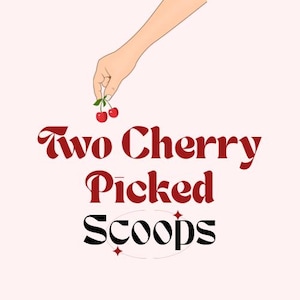 May include: A digital illustration features a hand holding two cherries with green stems. The text "Two Cherry Picked Scoops" is in a dark red, stylized font, with "Scoops" in black. The background is a soft pink.