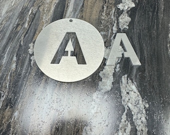 aluminum circles, shapes, letters cut out.
