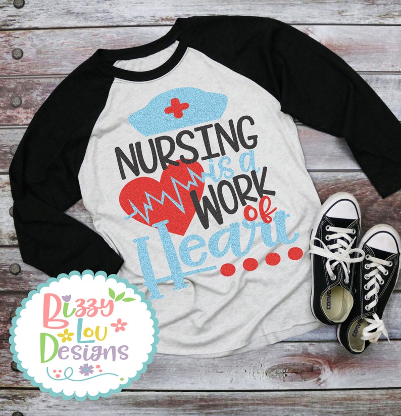 May include: A white and black baseball tee shirt with a blue and red graphic that says "Nursing is a work of heart".