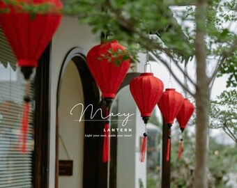 May include: Red paper lanterns hanging from a building with the text "Macy Lantern, light your soul, guide your heart".
