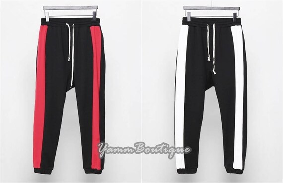 Jogging gris foncé, ceinture élastique, poches zip