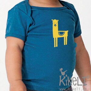 May include: A teal blue baby onesie with a yellow llama graphic. The llama has a yellow body, a white face, and black eyes. The onesie has a white collar and short sleeves.