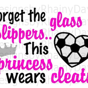 May include: A pink and black graphic design with a soccer ball in the shape of a heart. The text reads "Forget the glass slippers. This princess wears cleats."
