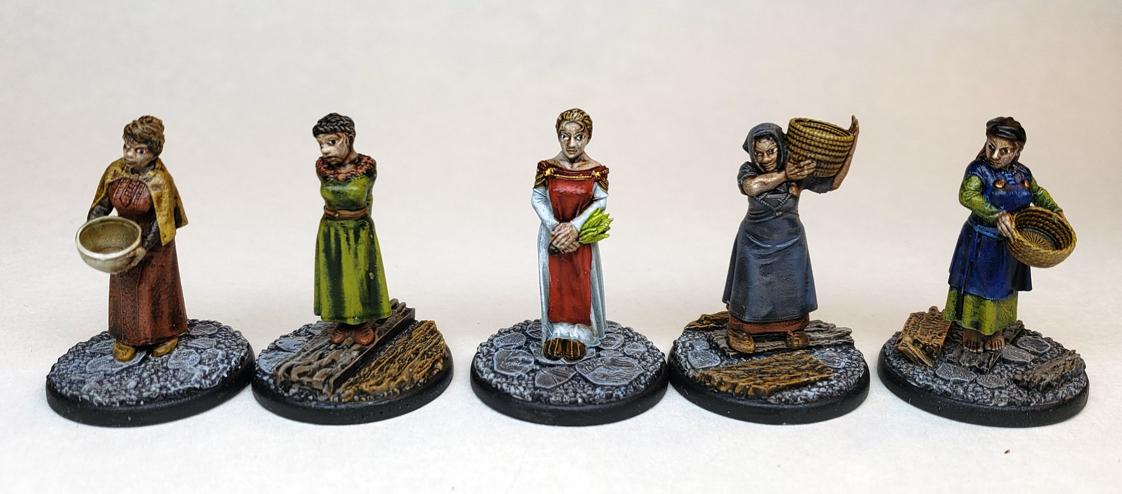 Collection de meubles médiévaux rustiques comprenant des lits, des
