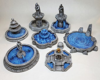 May include: Set of eight miniature stone fountains with blue water, featuring various designs including a hooded figure, a swirling pool, and a simple square fountain.