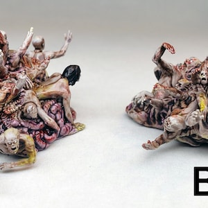 May include: Two detailed, grotesque, multi-colored, fleshy, human-like figures with multiple limbs and faces. The figures are made of a fleshy, organic material and appear to be melting or decaying. The figures are labeled A and B.