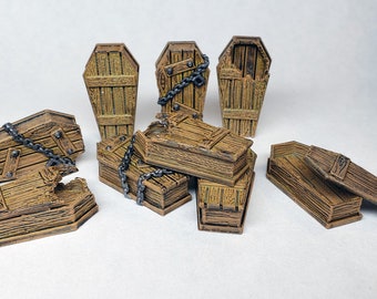 May include: A collection of miniature wooden coffins, some open, some closed, and some with chains. The coffins are various sizes and have a weathered, aged appearance. The color is a medium brown with darker brown accents.