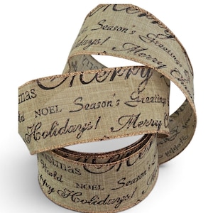 May include: A tan, textured ribbon with a metallic copper edge, featuring repeating black script text that reads Merry Christmas, Season's Greetings, Happy Holidays, and NOEL. The ribbon is coiled in a loop, displaying its woven fabric surface.